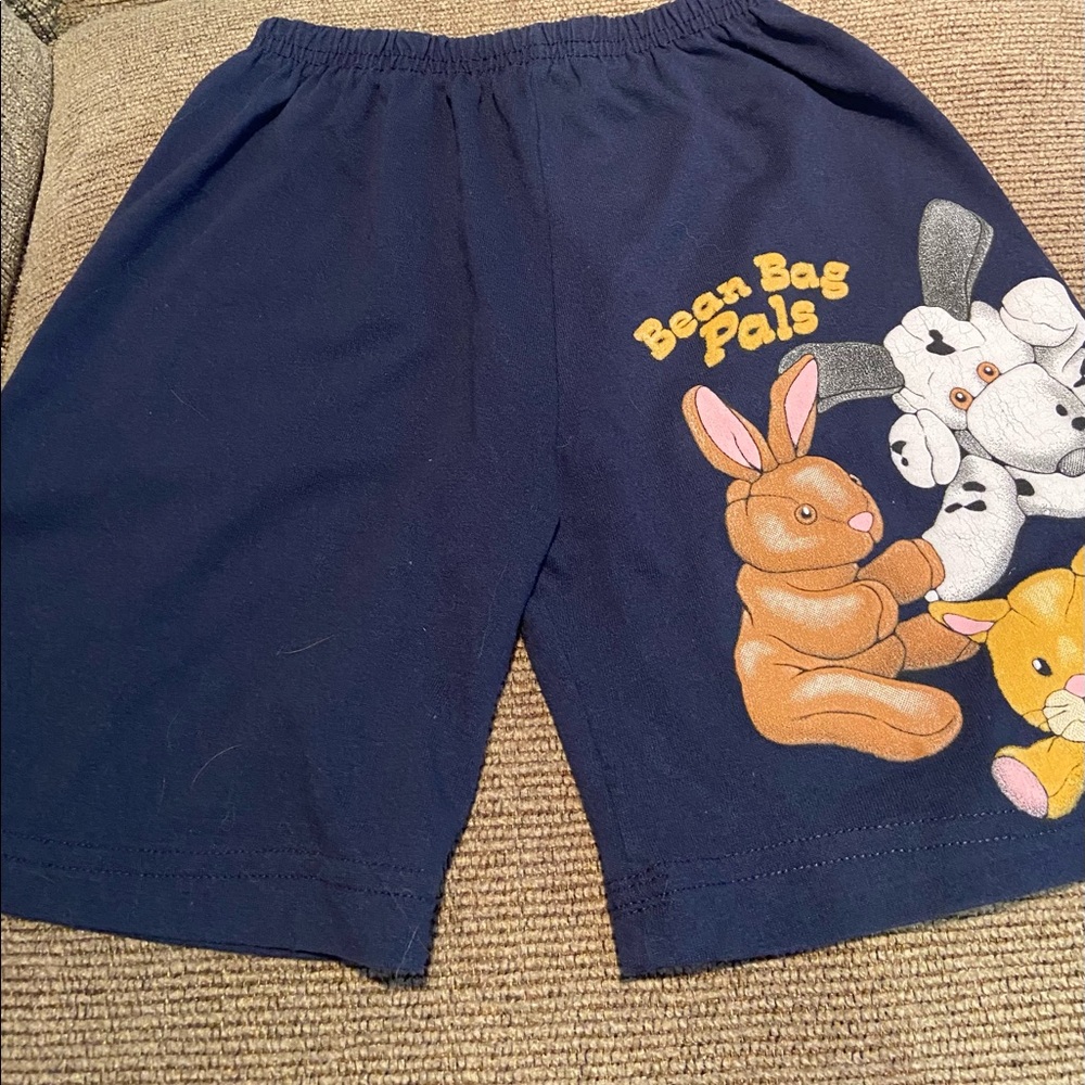 Blue elastic waist shorts with design on front